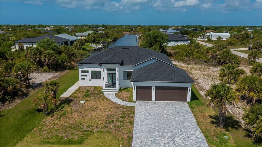 Waterfront living with direct Gulf access awaits in this - Beach Home for sale in Port Charlotte, Florida on Beachhouse.com