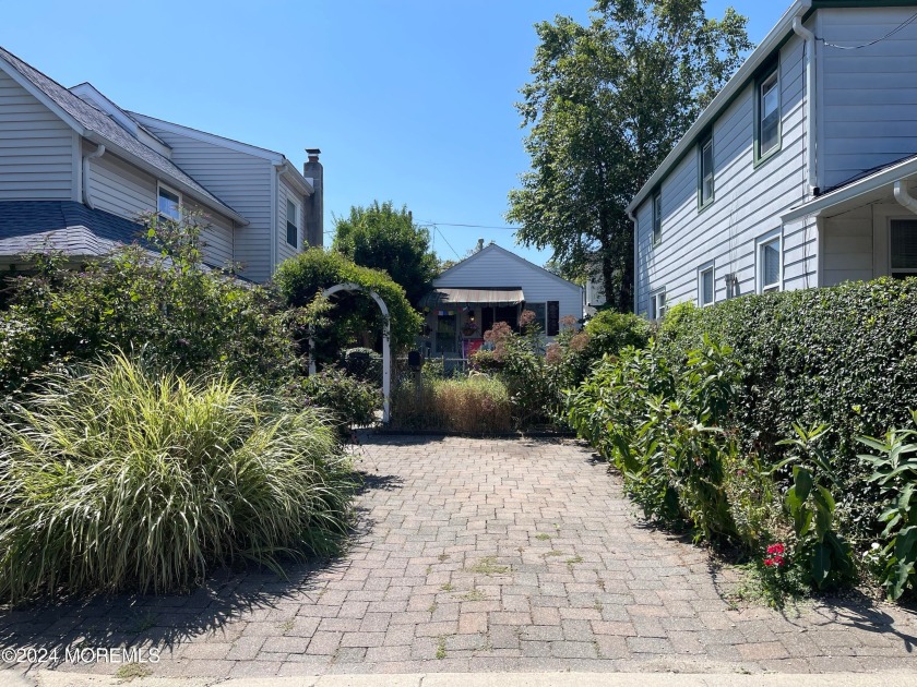 A home tucked away from the street offers a cozy and private - Beach Home for sale in Bradley Beach, New Jersey on Beachhouse.com