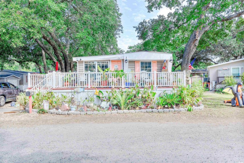 This is a must see. Great landscaping/ front and back gardens - Beach Home for sale in Garden City Beach, South Carolina on Beachhouse.com