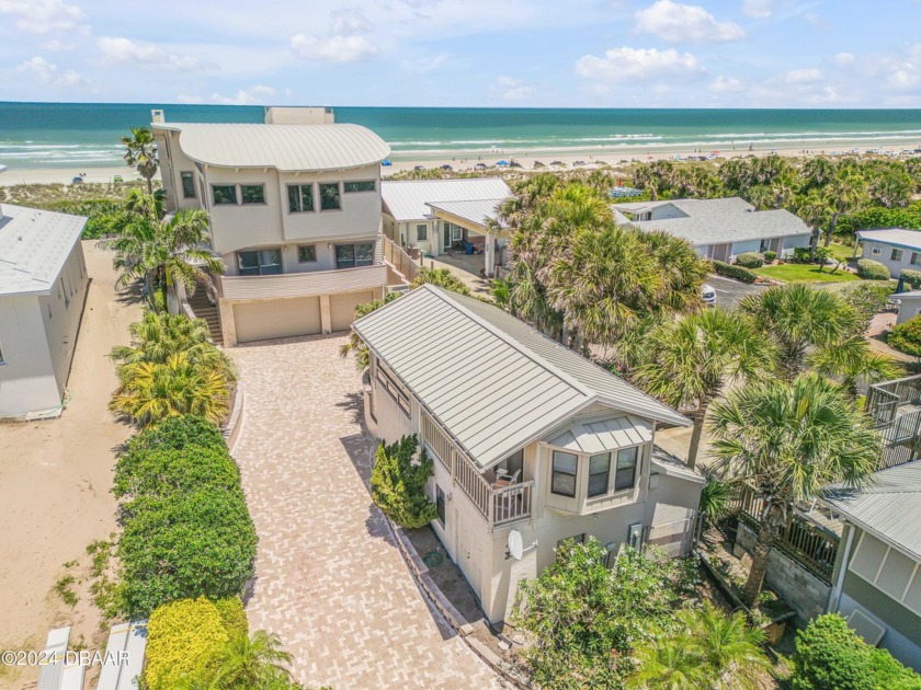 Emerge into a realm where the serene symphony of ocean waves and - Beach Home for sale in New Smyrna Beach, Florida on Beachhouse.com