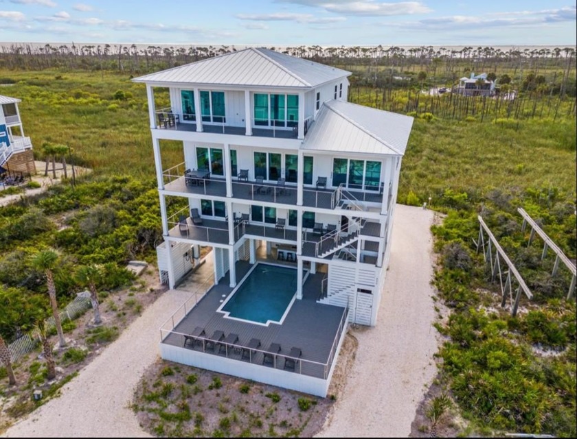 A SHOWSTOPPER of a home! Located in Secluded Dunes subd. This - Beach Home for sale in Cape San Blas, Florida on Beachhouse.com