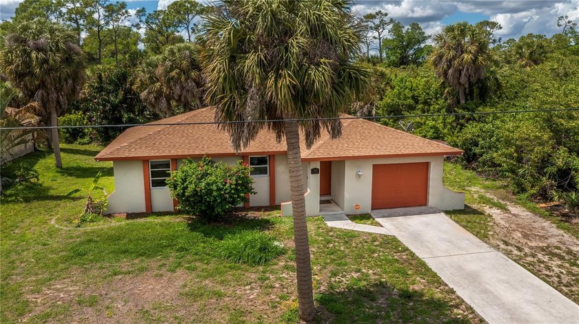 Don't miss this beautifully renovated waterfront home located on - Beach Home for sale in Port Charlotte, Florida on Beachhouse.com
