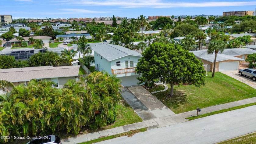 This stunning, two-story, completely renovated home offers a - Beach Home for sale in Indian Harbour Beach, Florida on Beachhouse.com