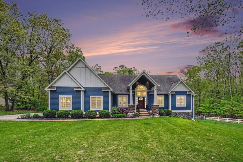 Nestled among mature woods on more than an acre, this stunning - Beach Home for sale in Whitehall, Michigan on Beachhouse.com