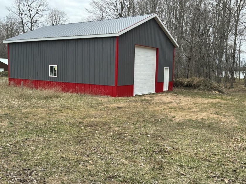 133' on Big Manistique lake with New 30x40 pole barn with 14' - Beach Lot for sale in Mcmillan, Michigan on Beachhouse.com