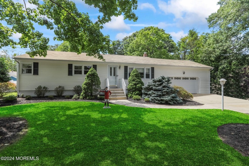 Welcome to this charming expanded ranch style home. Perfect for - Beach Home for sale in Oakhurst, New Jersey on Beachhouse.com