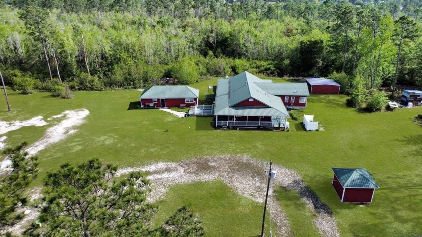 Escape to your own slice of paradise with this 5 bedroom 3 bath - Beach Home for sale in Wewahitchka, Florida on Beachhouse.com
