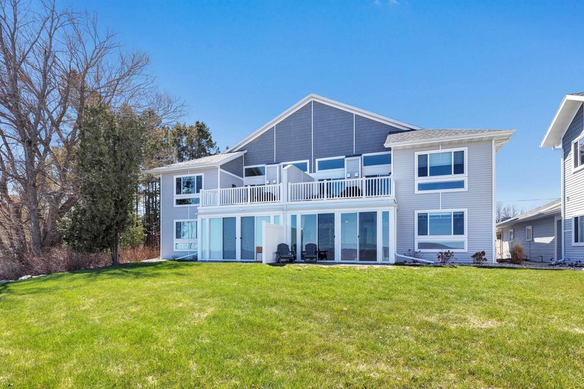 Experience tranquil lakefront luxury at Bell Harbour! This rare - Beach Condo for sale in Algoma, Wisconsin on Beachhouse.com