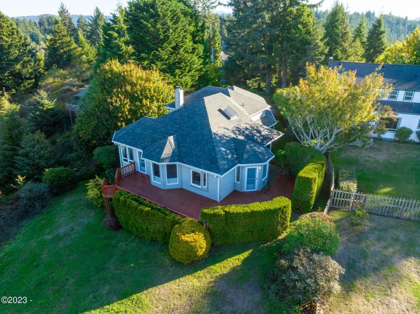 Located near the top of a hill overlooking Waldport, the views - Beach Home for sale in Waldport, Oregon on Beachhouse.com
