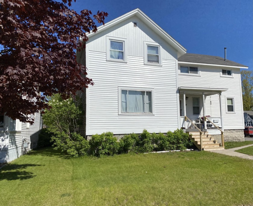 Income property with four rental units. The house is situated on - Beach Townhome/Townhouse for sale in Alpena, Michigan on Beachhouse.com