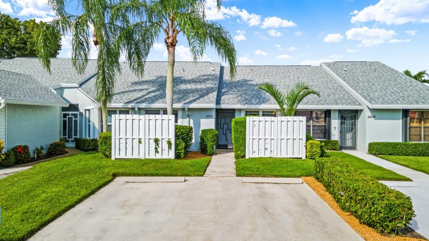 This incredibly renovated villa sits in a prime location within - Beach Home for sale in Boynton Beach, Florida on Beachhouse.com