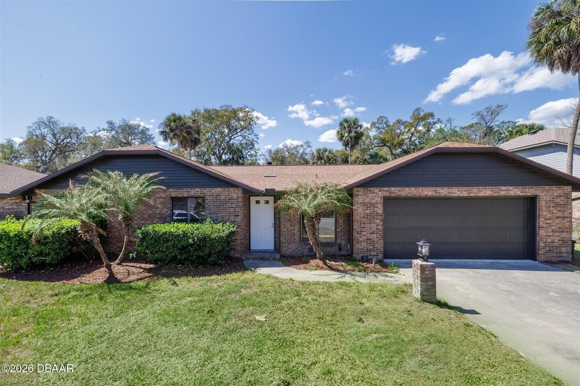 This beautifully maintained pool home in Oak Forest, Ormond - Beach Home for sale in Ormond Beach, Florida on Beachhouse.com