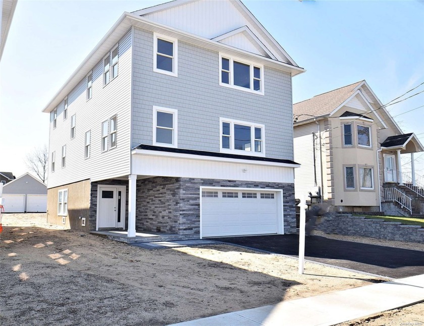 Welcome to Beautiful brand new detached two family with three - Beach Home for sale in East Rockaway, New York on Beachhouse.com