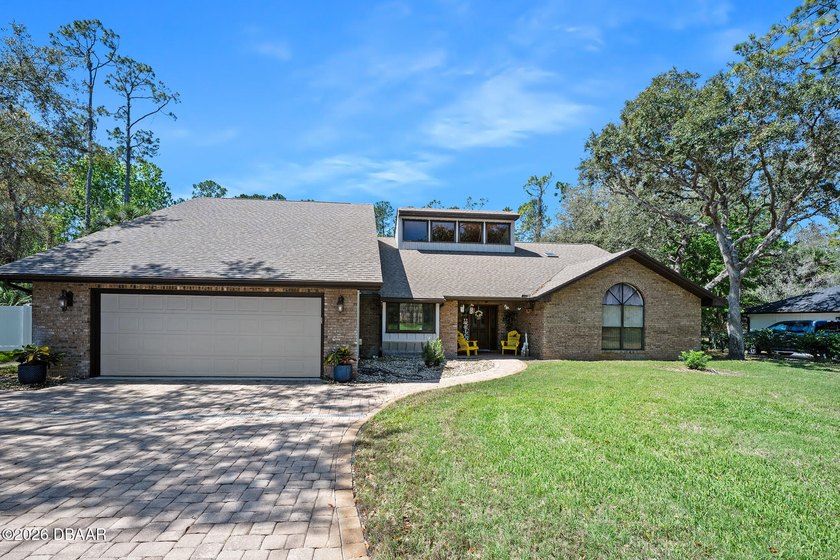 Spacious 4,400+ sq ft estate on a 3/4-acre lot backing to - Beach Home for sale in Ormond Beach, Florida on Beachhouse.com