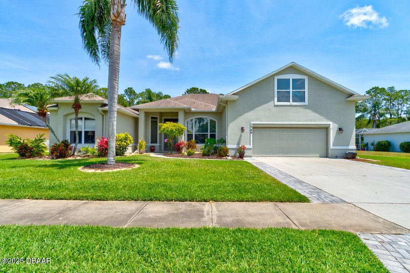Step into this beautifully updated 4-bedroom, 3.5-bath residence - Beach Home for sale in Port Orange, Florida on Beachhouse.com