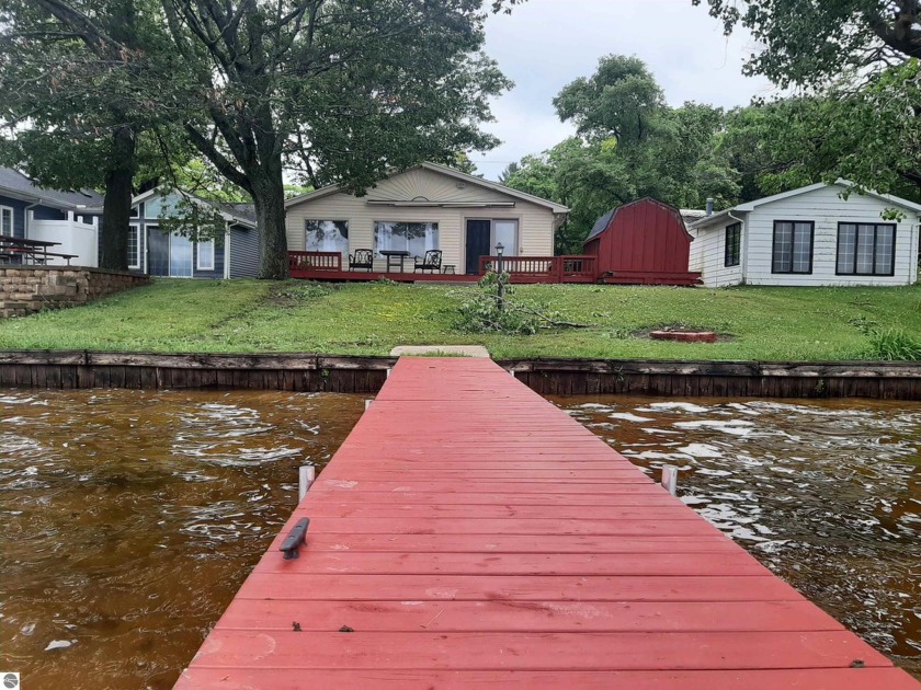 Get away to this updated cottage with great swimming frontage on - Beach Home for sale in Oscoda, Michigan on Beachhouse.com