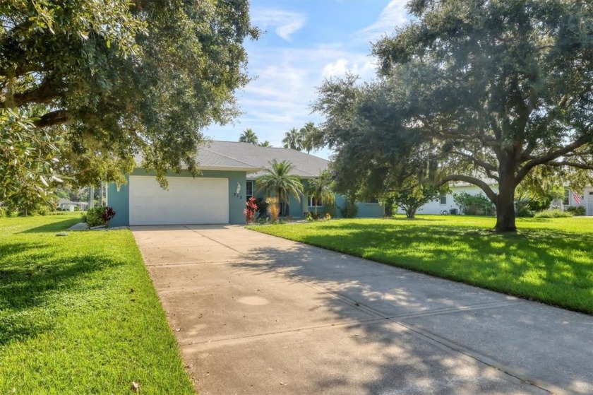 Dreamy three-bedroom pool home with den and breathtaking lake - Beach Home for sale in Bradenton, Florida on Beachhouse.com