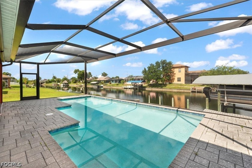 Enjoy waterfront living in this 3 bed plus den, 2 bath, POOL - Beach Home for sale in Cape Coral, Florida on Beachhouse.com