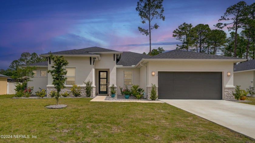 Welcome to this exceptional 2022-built home with NO HOA and - Beach Home for sale in Palm Coast, Florida on Beachhouse.com