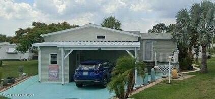 This stunning three-bedroom, two-bath triple wide offers an - Beach Home for sale in Barefoot Bay, Florida on Beachhouse.com