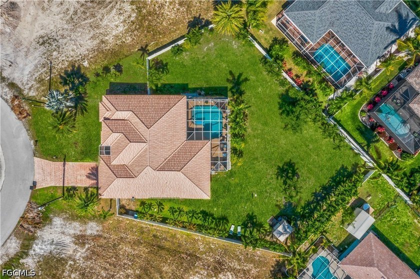 Tucked away on a nearly half acre corner lot, this pool home - Beach Home for sale in Cape Coral, Florida on Beachhouse.com