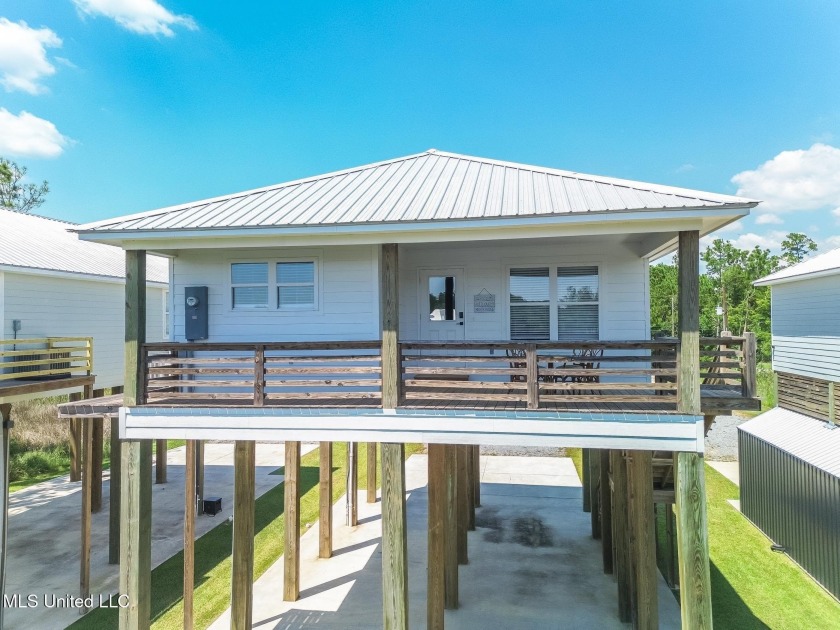 This stunning property, built in 2023, has been thoughtfully and - Beach Home for sale in Bay Saint Louis, Mississippi on Beachhouse.com