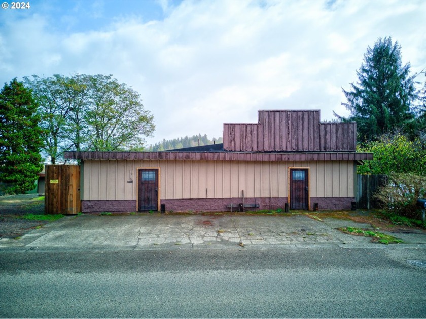 Situated along the serene banks of Coal Bank River, this - Beach Commercial for sale in Coos Bay, Oregon on Beachhouse.com