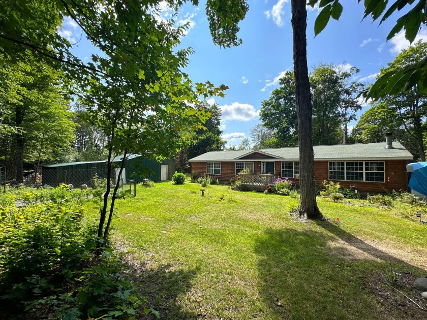 This 3 bedroom, 2 bath home sits on 5.6 acres in the heart of - Beach Home for sale in Trout Lake, Michigan on Beachhouse.com