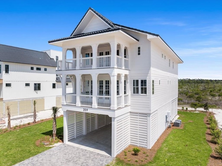 This thoughtfully crafted coastal haven rises just moments from - Beach Home for sale in Mexico Beach, Florida on Beachhouse.com
