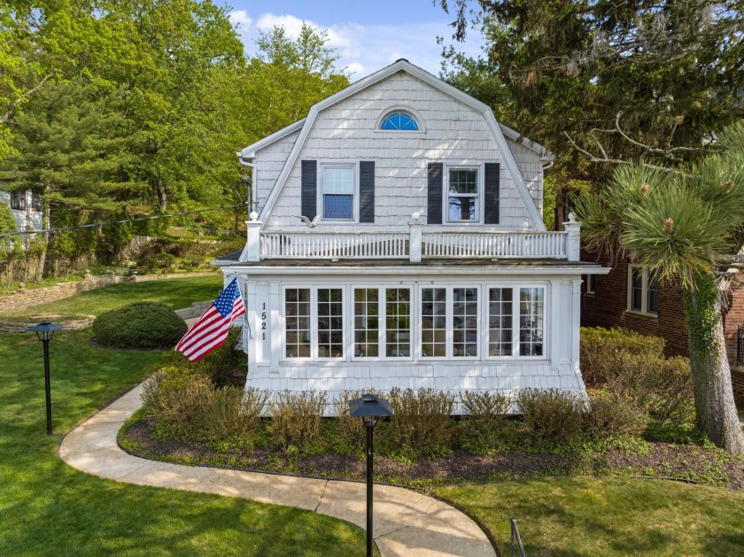 This Dutch Colonial home is nestled on 2 beautifully landscaped - Beach Home for sale in Michigan City, Indiana on Beachhouse.com