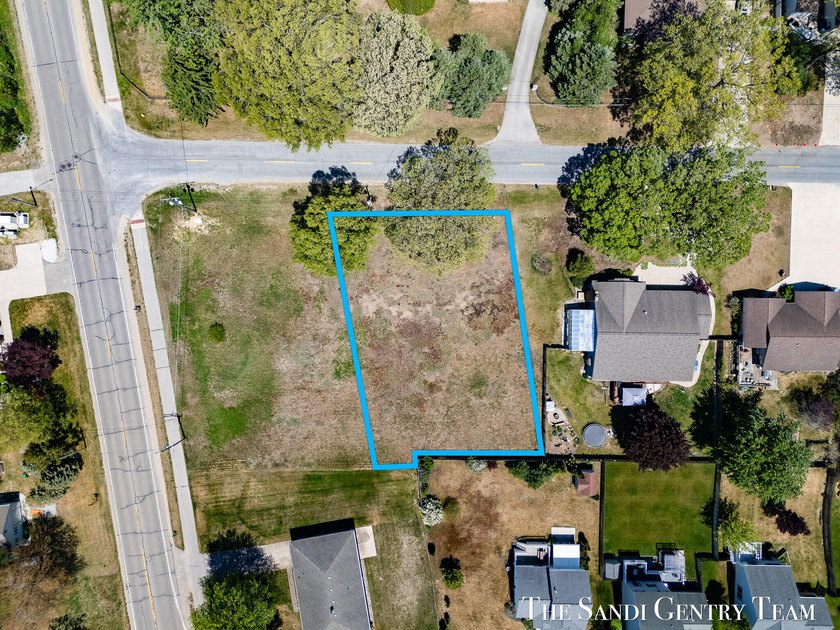 Nestled in the heart of charming Spring Lake, this beautiful - Beach Lot for sale in Spring Lake, Michigan on Beachhouse.com