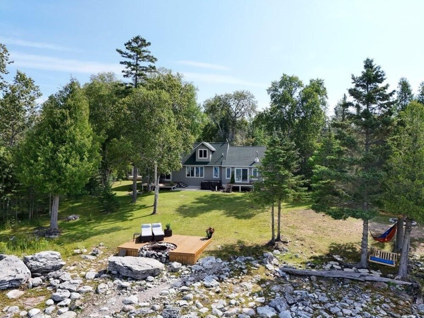 Year-round home on Drummond Island! Imagine a cozy retreat with - Beach Home for sale in Drummond Island, Michigan on Beachhouse.com