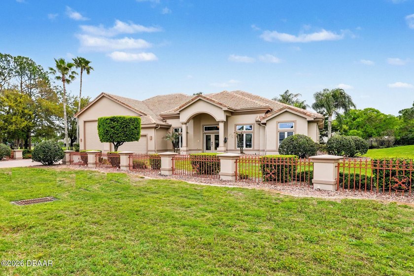 Located in the 24/7 guard-gated Spruce Creek Fly-In community - Beach Home for sale in Port Orange, Florida on Beachhouse.com