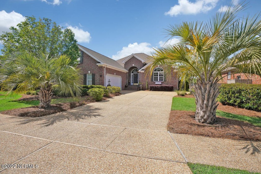 Enjoy serene pond views with this stunning brick home located in - Beach Home for sale in Leland, North Carolina on Beachhouse.com
