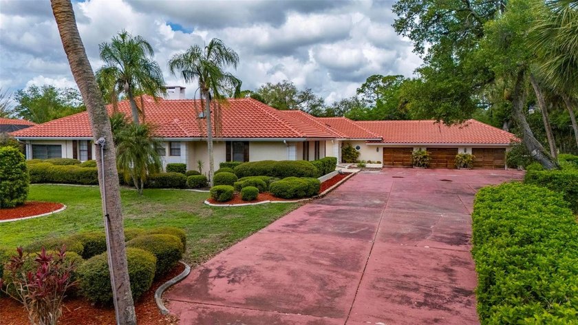 Set on a rare and expansive 5.4-acre parcel in the heart of town - Beach Home for sale in Port Charlotte, Florida on Beachhouse.com