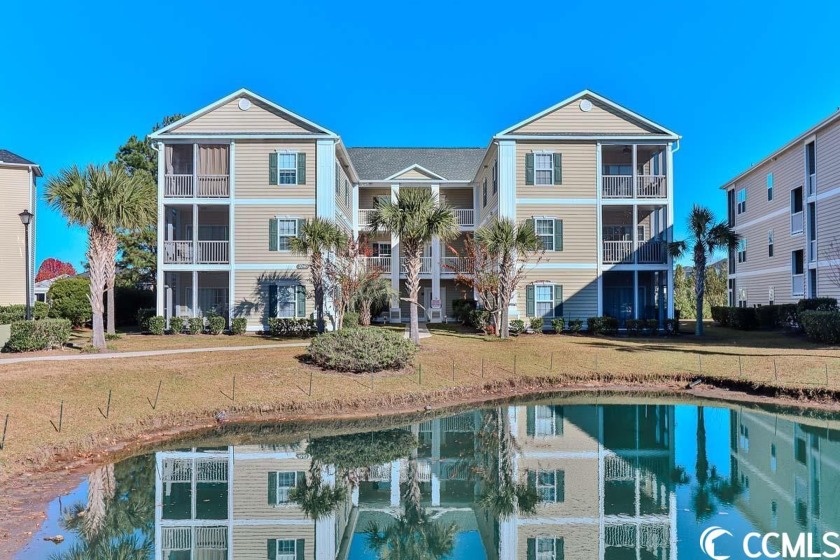 This stunning 2-bedroom, 2-bathroom end unit, pond view condo at - Beach Condo for sale in Surfside Beach, South Carolina on Beachhouse.com