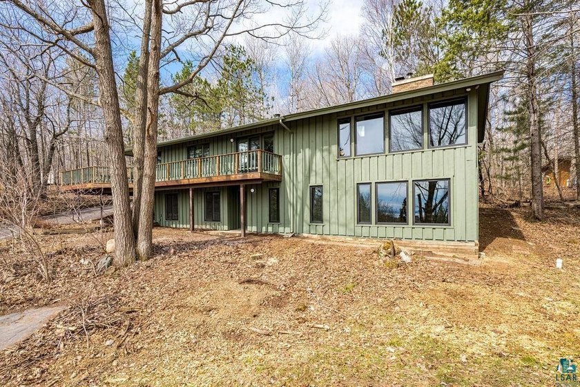 Experience a fully reimagined mid-century home set on 1.12 - Beach Home for sale in Duluth, Minnesota on Beachhouse.com