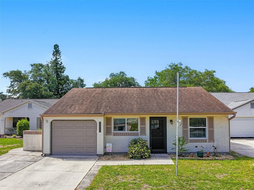 Positioned in the sought-after Oak Hollow community of Port - Beach Home for sale in Port Charlotte, Florida on Beachhouse.com