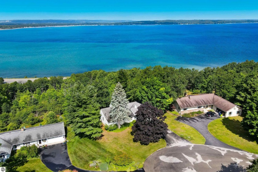 Perched on a hill with stunning views of East Bay, this house - Beach Home for sale in Traverse City, Michigan on Beachhouse.com