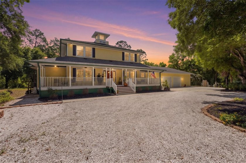 Set behind a private gate and framed by nearly 4 acres of lush - Beach Home for sale in North Port, Florida on Beachhouse.com