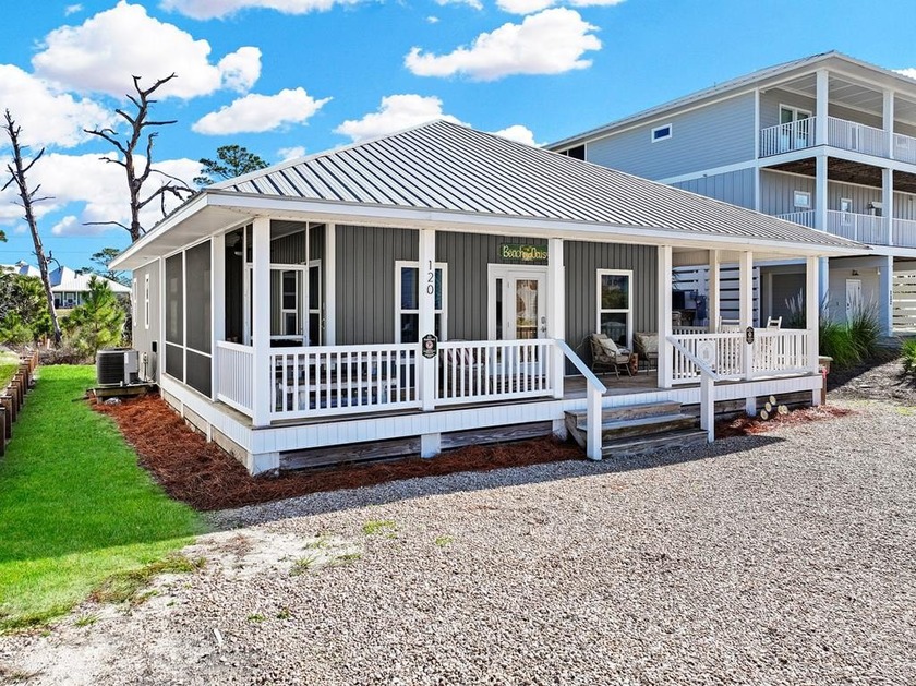 This charming single-level coastal cottage captures the essence - Beach Home for sale in Cape San Blas, Florida on Beachhouse.com
