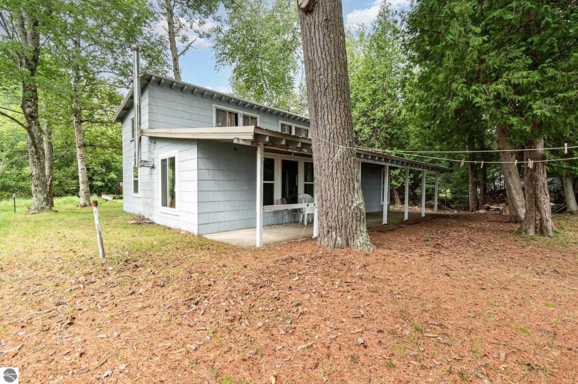 Fun-filled cottage on 100' of sandy Lake Huron beach frontage - Beach Home for sale in Harrisville, Michigan on Beachhouse.com