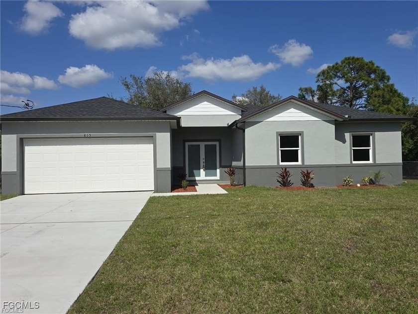 Stunning New Construction Home in Lehigh Acres, FL! this - Beach Home for sale in Lehigh Acres, Florida on Beachhouse.com