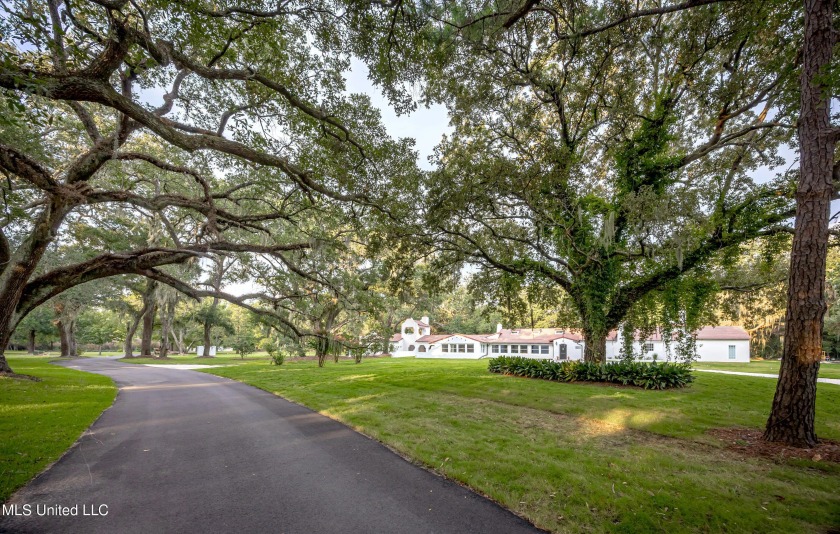 Step back in time to this extraordinary 1888 Spanish-style - Beach Home for sale in Ocean Springs, Mississippi on Beachhouse.com