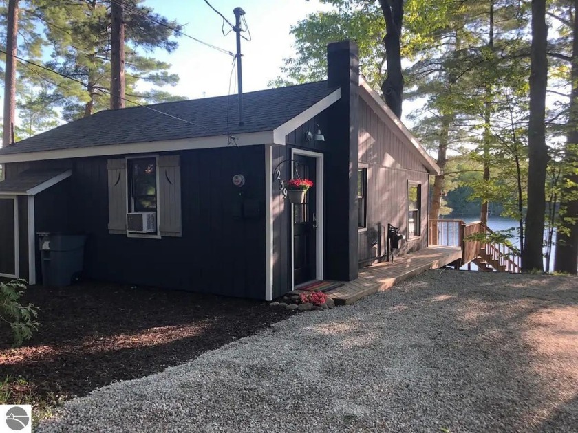 Discover two beautifully renovated late1950s cabins nestled on - Beach Home for sale in Traverse City, Michigan on Beachhouse.com