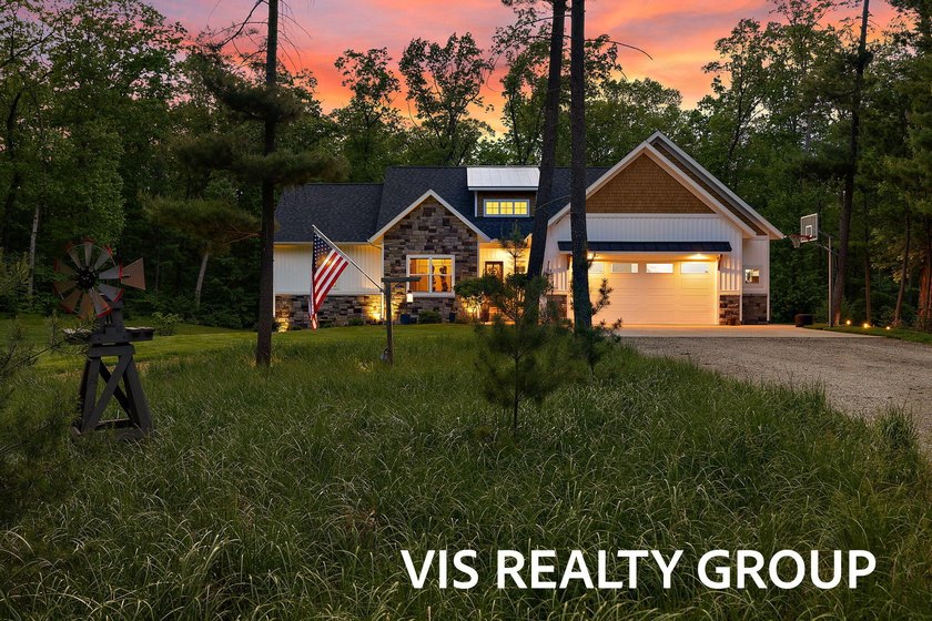 Set on 10 private acres, this custom-built 2018 home blends - Beach Home for sale in Grand Haven, Michigan on Beachhouse.com