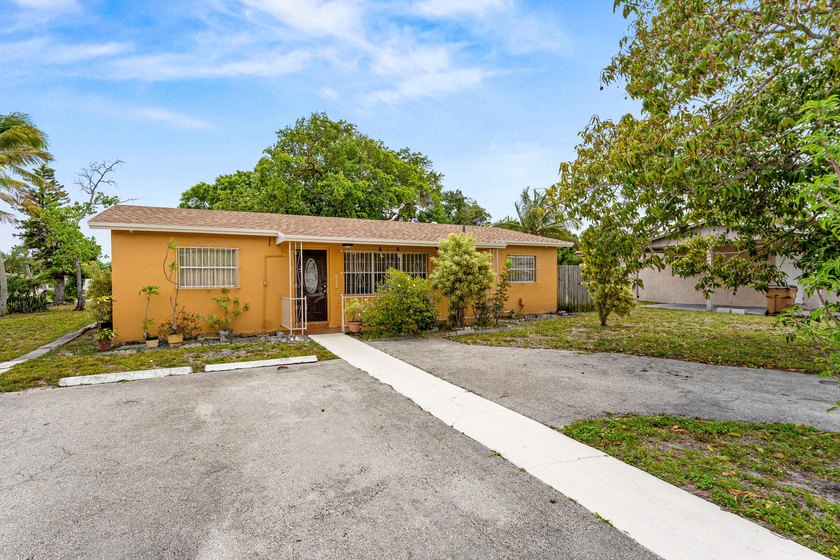 Welcome to this versatile and generously sized property with a - Beach Home for sale in Deerfield Beach, Florida on Beachhouse.com