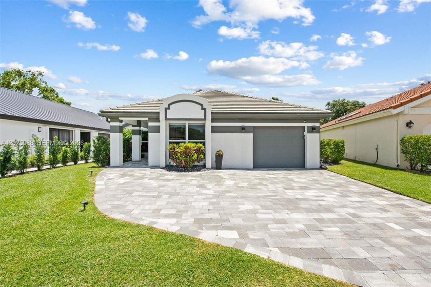 This fully renovated residence blends refined design with - Beach Home for sale in Boca Raton, Florida on Beachhouse.com