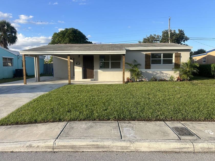 Move-in ready and beautifully updated, this 2-bedroom, 1-bath - Beach Home for sale in Riviera Beach, Florida on Beachhouse.com