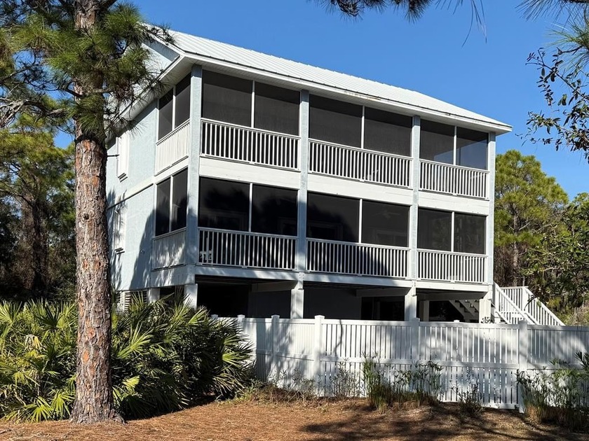 With 2018 square feet of living space, plus two large covered - Beach Home for sale in St. George Island, Florida on Beachhouse.com